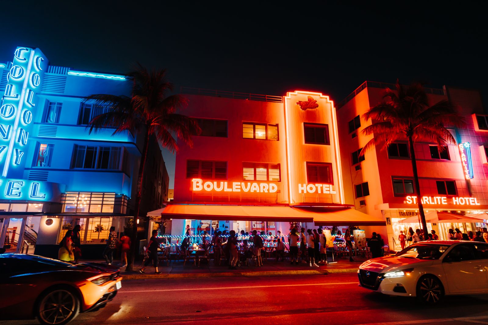 Lit-up art deco hotels and nightlife along Miami's Ocean Drive at night